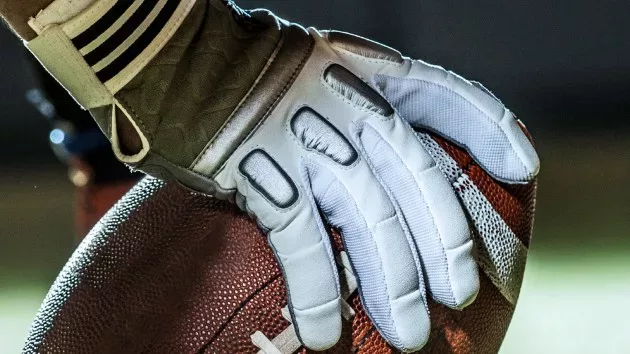hand on football