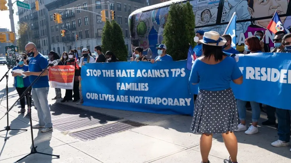 Members of Haitian women for Haitian refugees organization rally for restoration of TPS and permanent status for refugees from Haiti on Ocean Avenue New York^ NY - November 8^ 2020