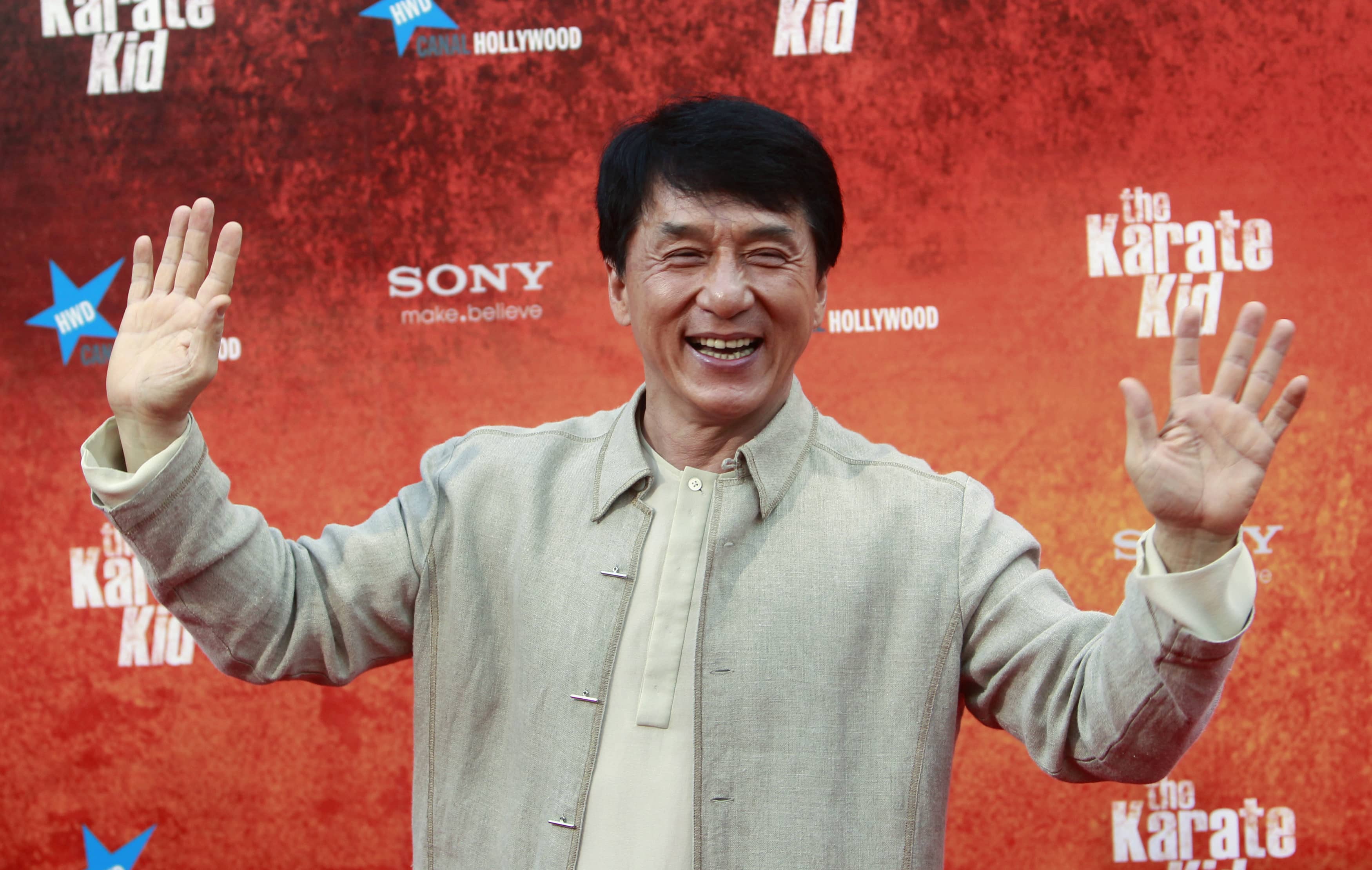 chinese-actor-chan-poses-for-photographers-as-he-arrives-for-the-premiere-of-the-karate-kid-in-madrid