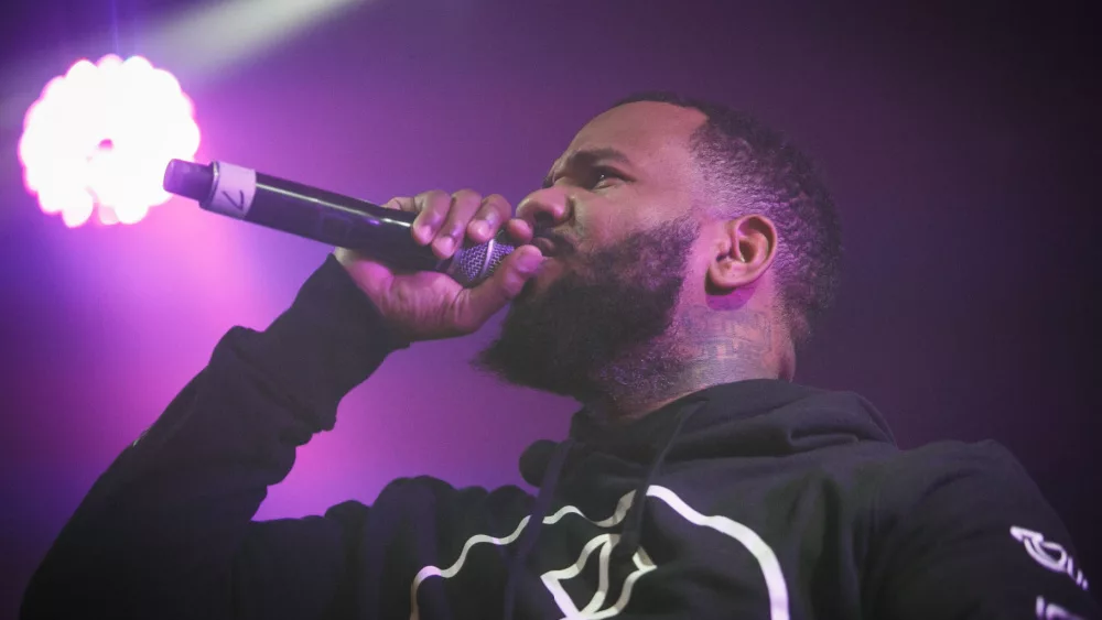 Rapper The Game performs on stage of nightclub.Music hall performing arts event.
