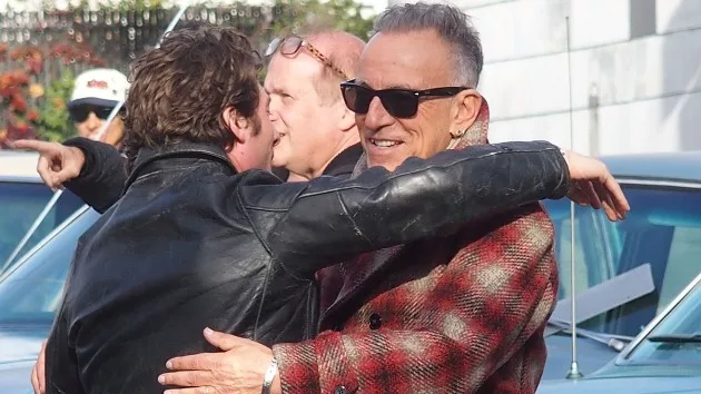 getty_brucehugsjaw_110524138899