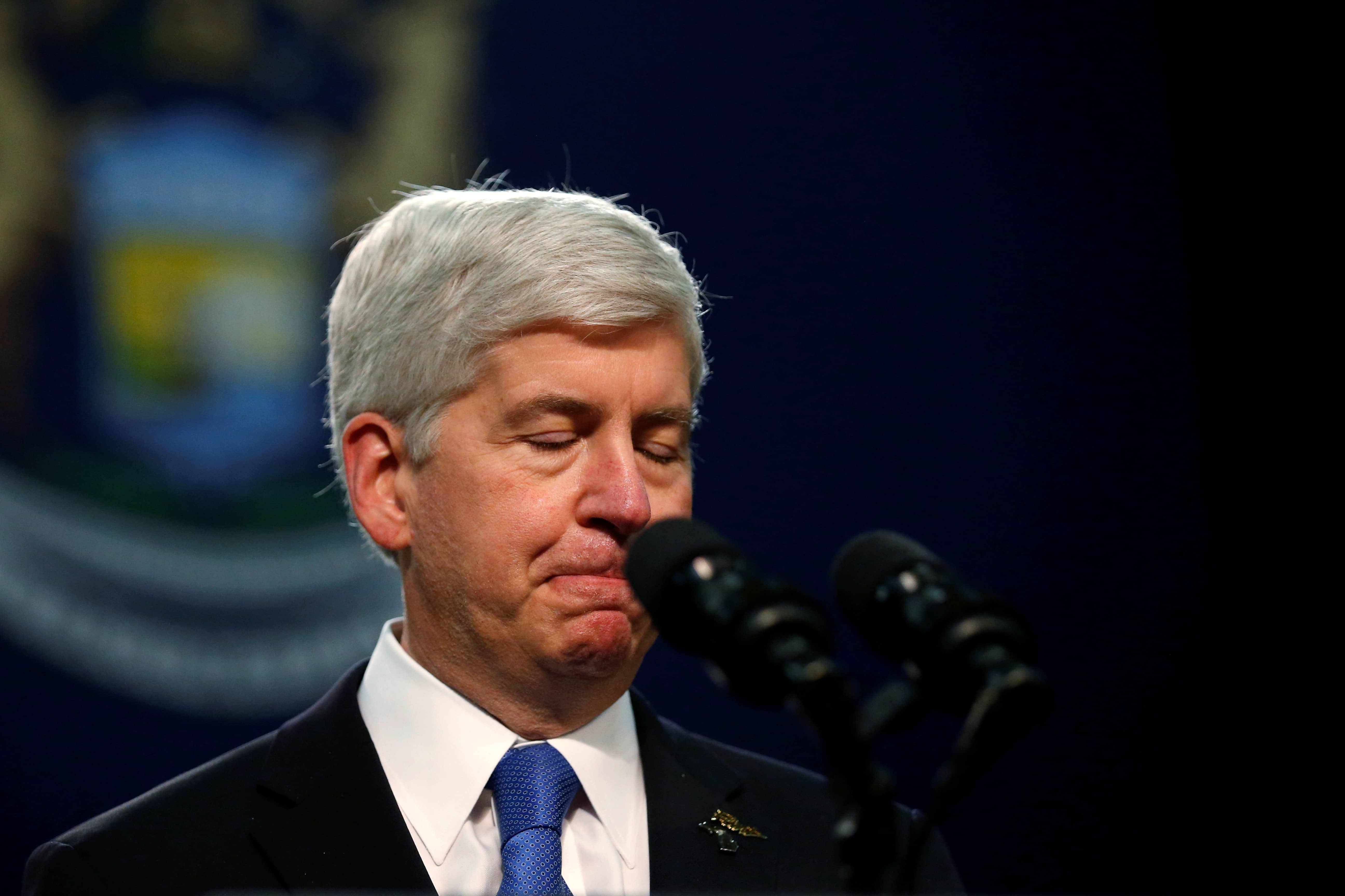 file-photo-michigan-governor-rick-snyder-pauses-as-he-speaks-at-north-western-high-school-in-flint-a-city-struggling-with-the-effects-of-lead-poisoned-drinking-water-in-michigan