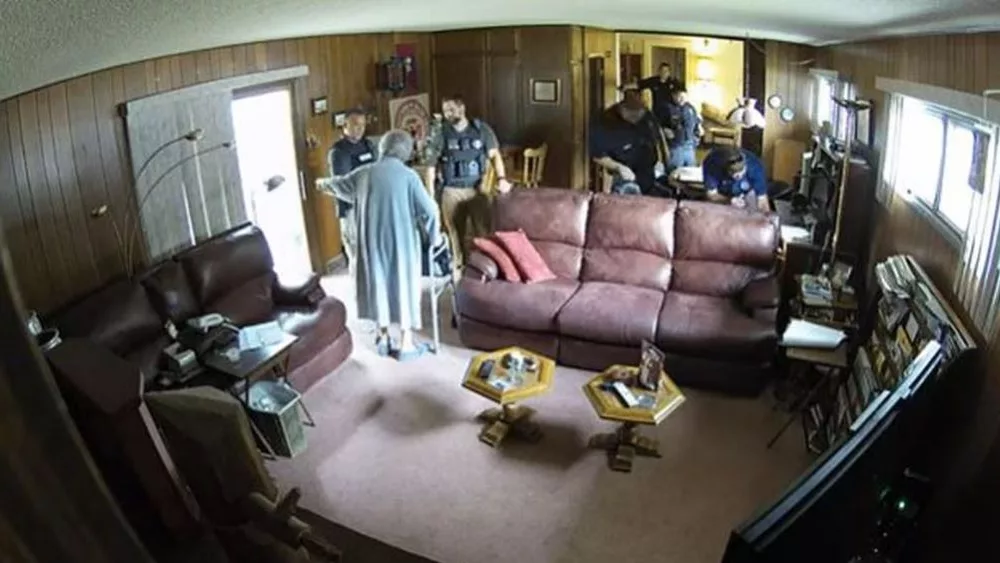 Surveillance video released on Monday shows Marion police and deputies raiding the home of 98-year-old Joan Meyer, the co-owner of the Marion County Record, a day before she died. (Marion County Record)