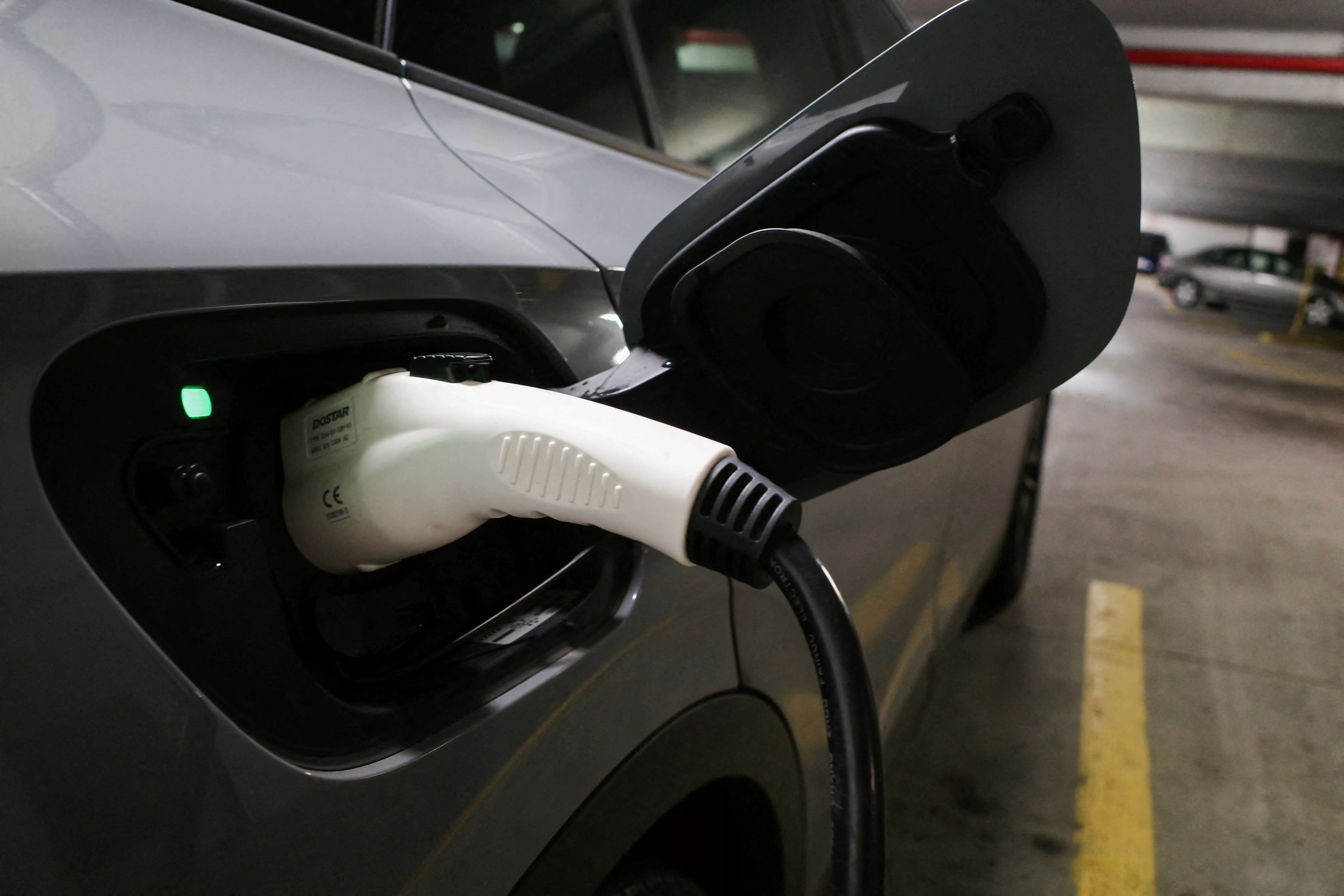 file-photo-a-charging-handle-recharges-a-volkswagen-id-4-electric-vehicle-parked-at-an-ev-charging-station-in-baltimore