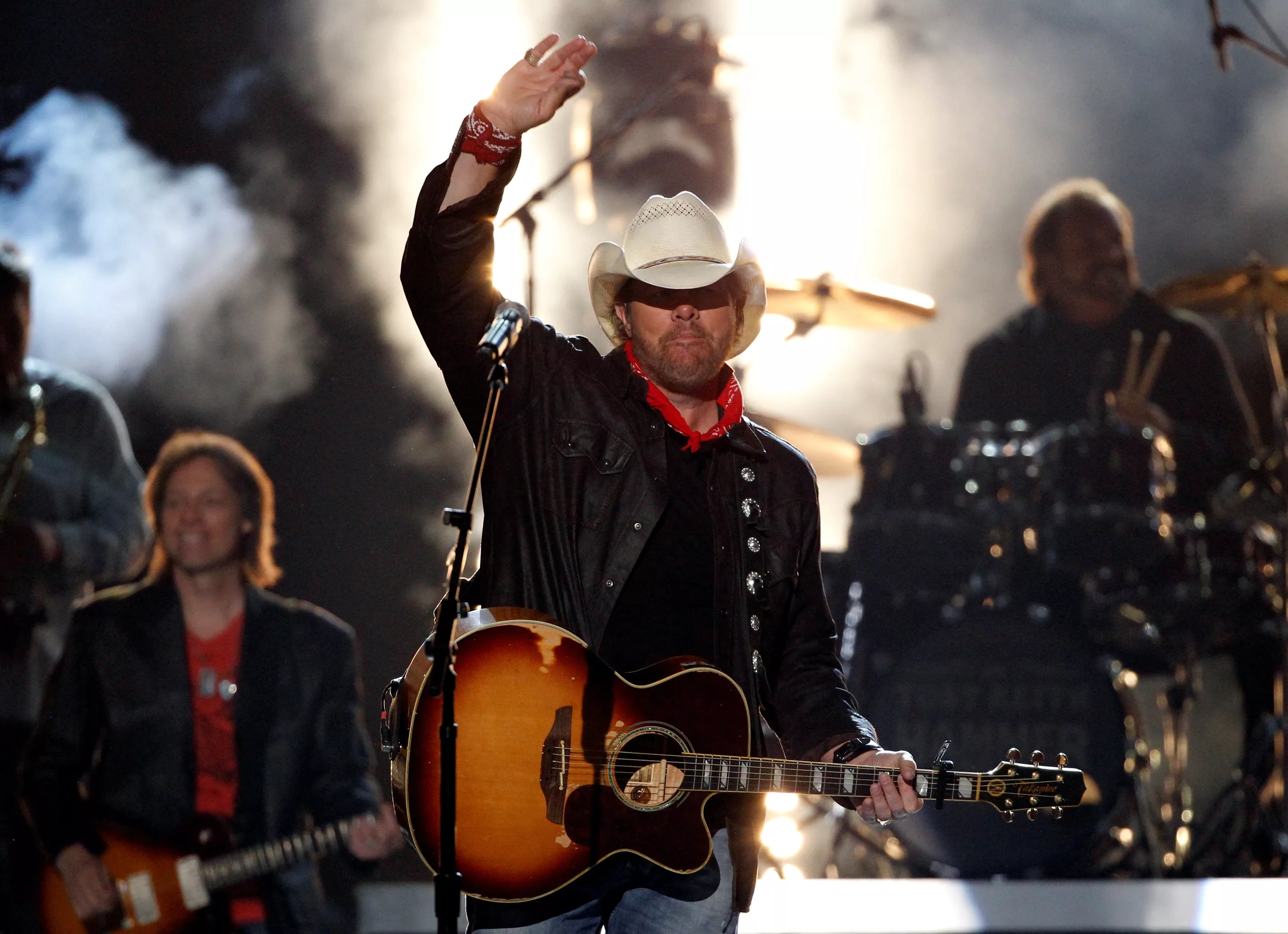 file-photo-toby-keith-waves-after-performing-shut-up-and-hold-on-at-the-49th-annual-academy-of-country-music-awards-in-las-vegas