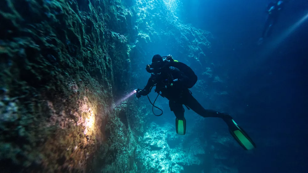 a-scuba-diver-explores-an-underwater-cave-at-the-island-of-brac