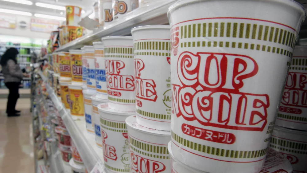 japans-instant-noodle-maker-nissins-cup-noodles-are-stacked-at-store-in-tokyo