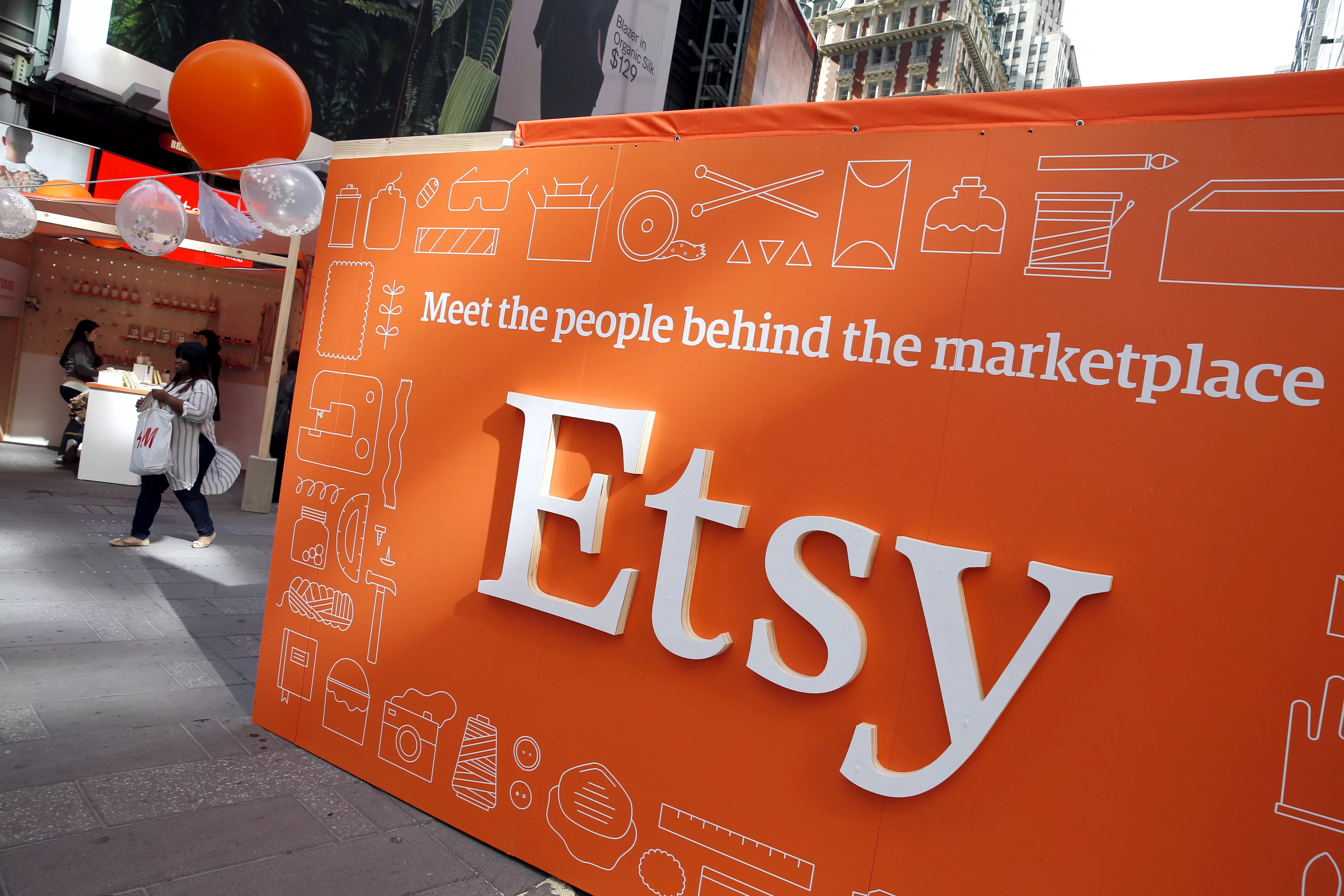 a-sign-advertising-the-online-seller-etsy-inc-is-seen-outside-the-nasdaq-market-site-in-times-square-following-etsys-ipo-in-new-york