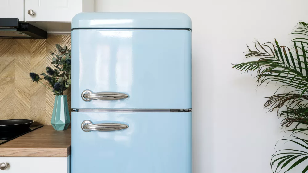 blue-refrigerator-with-stainless-steel-handles-in-retro-style-in-kitchen