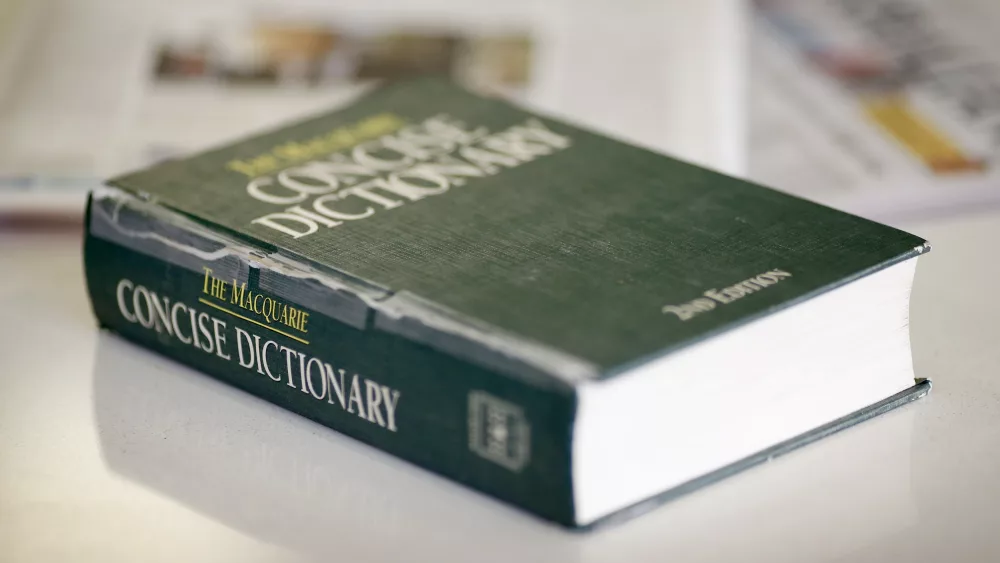 a-photo-illustration-shows-a-2nd-edition-copy-of-the-macquarie-concise-dictionaryon-a-coffee-table-in-sydney