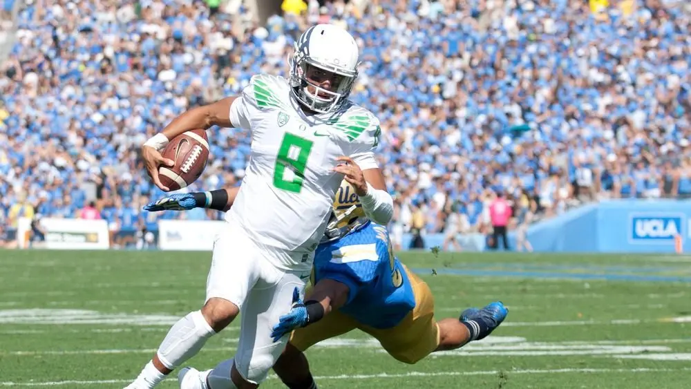 Oregon QB Marcus Mariota in action during the UCLA football game on October 11th 2014 in Pasadena^ California.