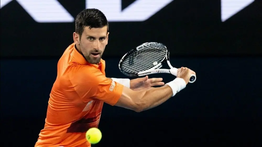 Novak Djokovic of Serbia hits a shot to Nick Kyrgios of Australia in an Arena Showdown charity match ahead of the 2023 Australian Open at Melbourne Park MELBOURNE^ AUSTRALIA - JANUARY 13