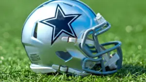 NFL Dallas Cowboys replica helmet on artificial grass playing turf ^ product shot