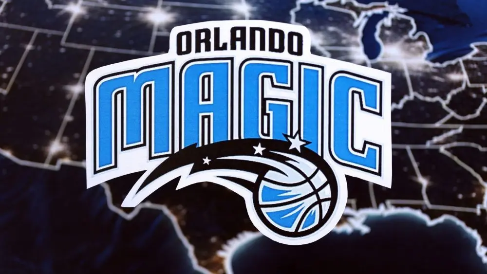 Orlando Magic basketball team badge lies on United States map background banner