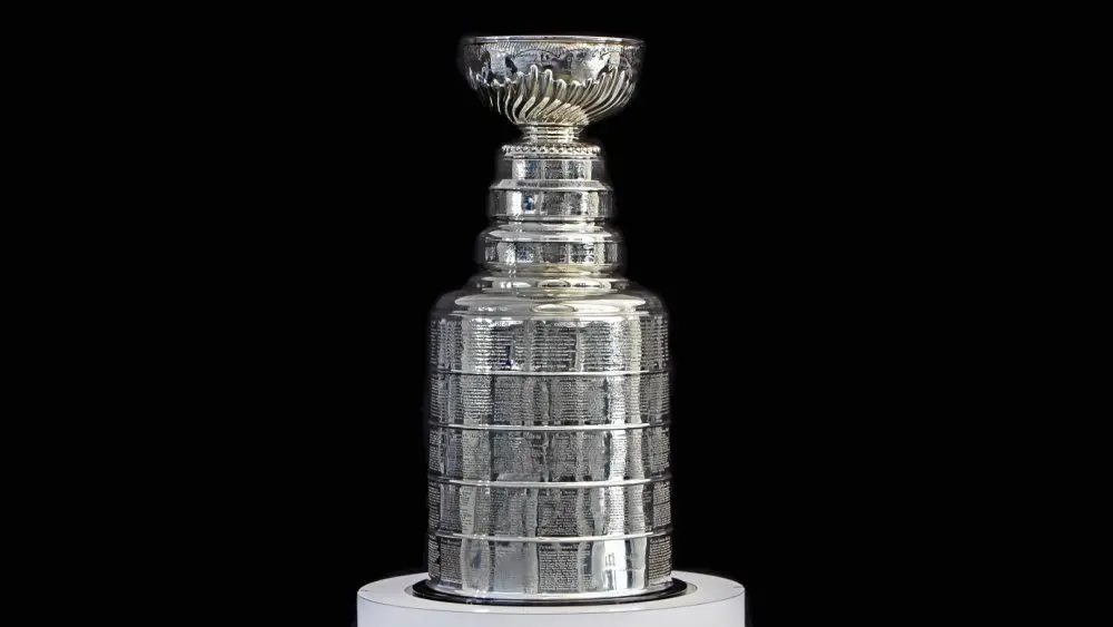 NHL ceremony - Stanley Cup trophy on the white stand^ black background^ Vancouver BC - October 22^ 2018