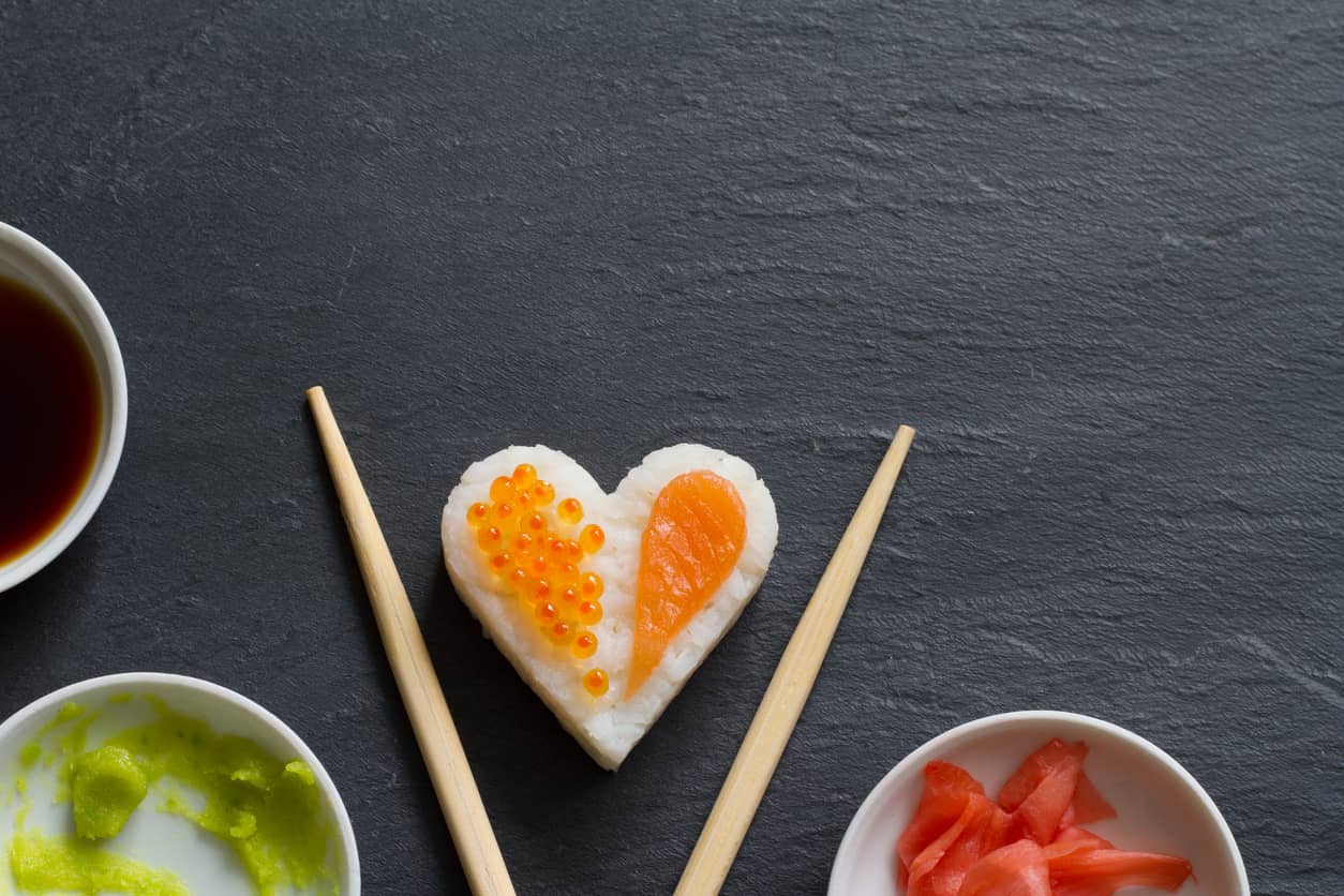 sushi-abstract-seafood-heart-concept-on-black-marble-menu-background