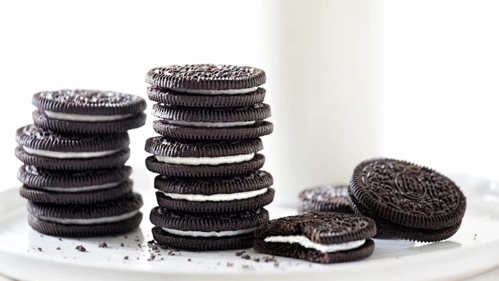 oreo-cookies-stacked-with-milk-on-white-background