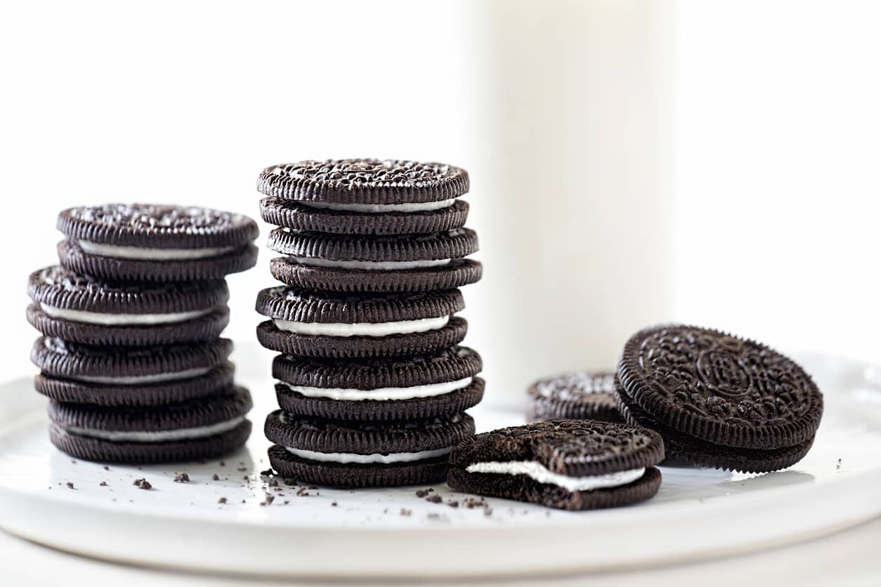 oreo-cookies-stacked-with-milk-on-white-background