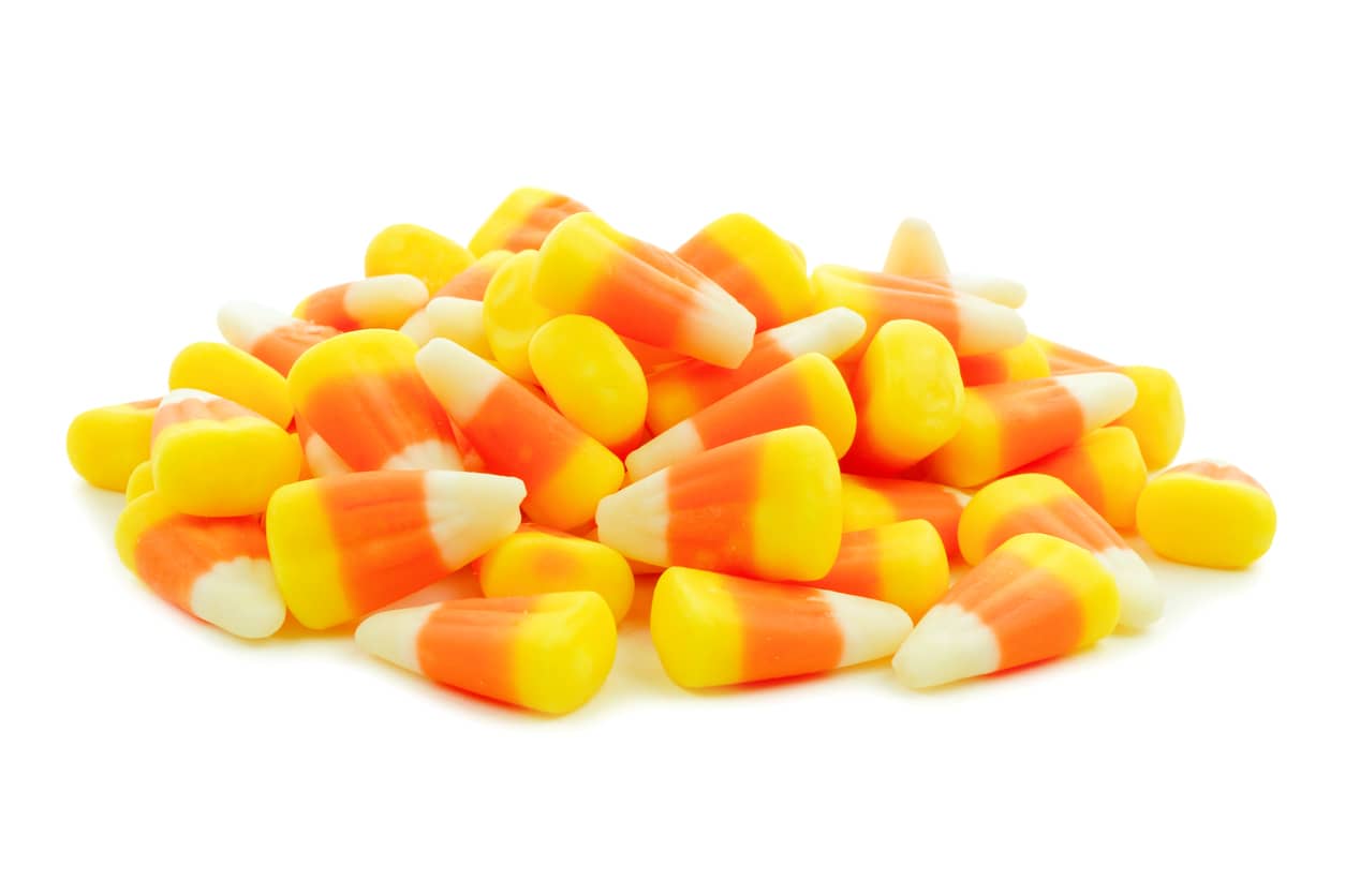 pile-of-halloween-candy-corn-over-white