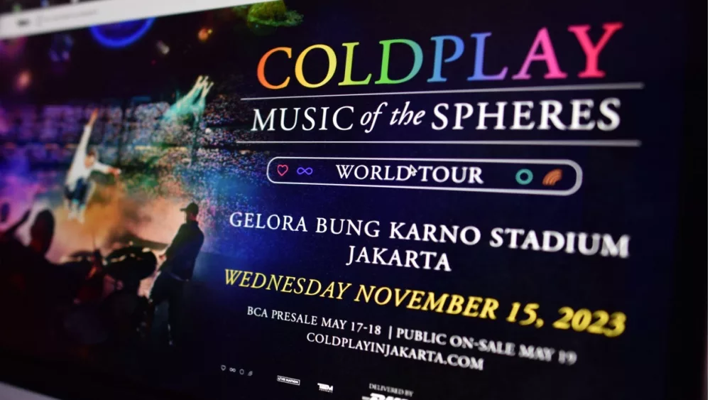 Website for the Coldplay 'Music Of The Sphere' world tour concert^ shown on laptop computer screen