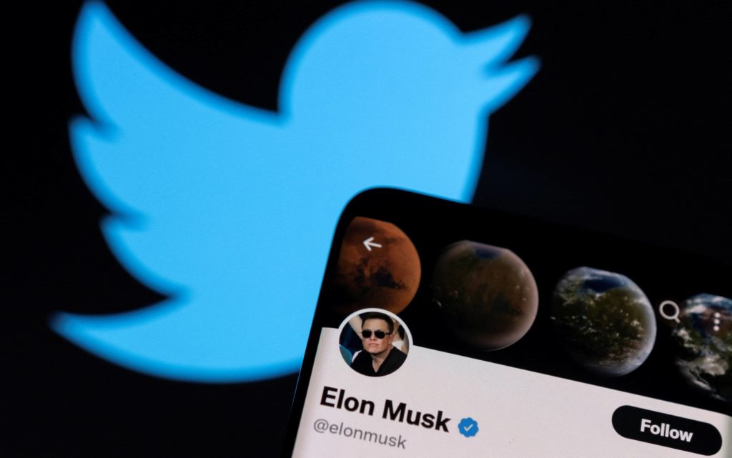 a-photo-illustration-shows-elon-musks-twitter-account-and-the-twitter-logo