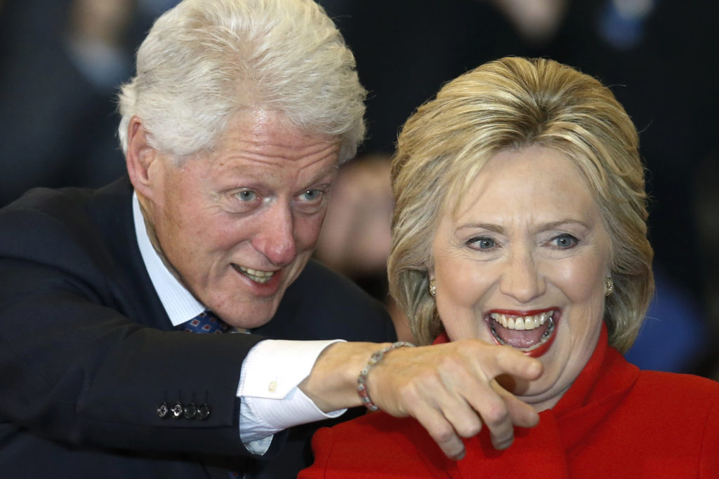 democratic-u-s-presidential-candidate-hillary-clinton-laughs-as-she-celebrates-with-her-husband-former-president-bill-clinton-at-her-caucus-night-rally-in-des-moines