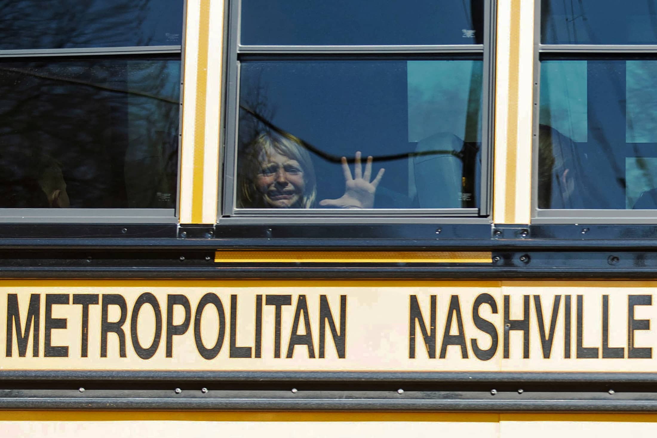 a-child-weeps-while-on-the-bus-leaving-the-covenant-school-following-a-mass-shooting-in-nashville