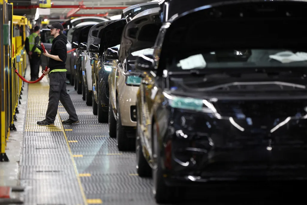 file-photo-a-member-of-staff-works-on-the-production-line-at-jaguar-land-rovers-factory-in-solihull