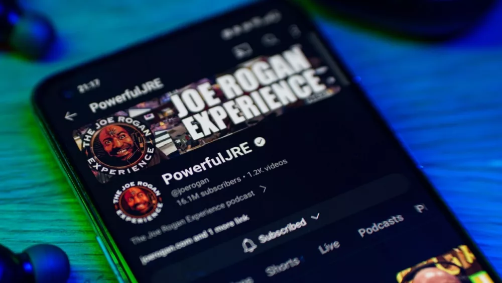 Joe Rogan experience podcast on smartphone screen.