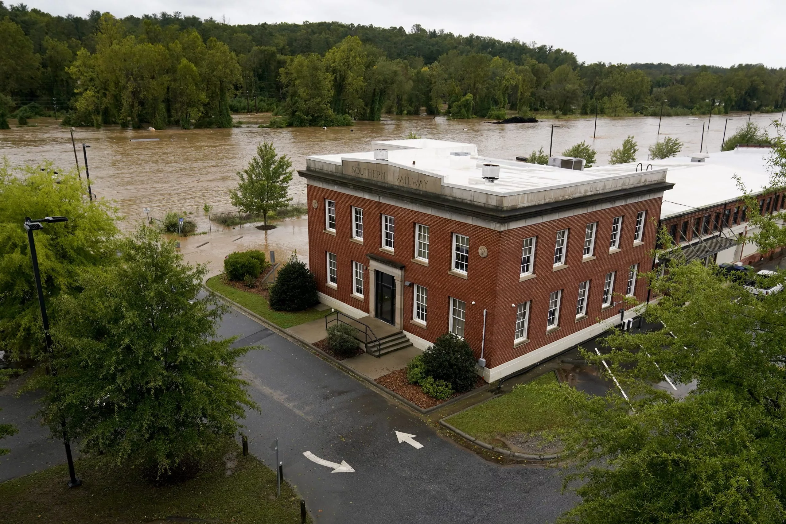 Torrential rains flood North Carolina mountains and create risk of dam