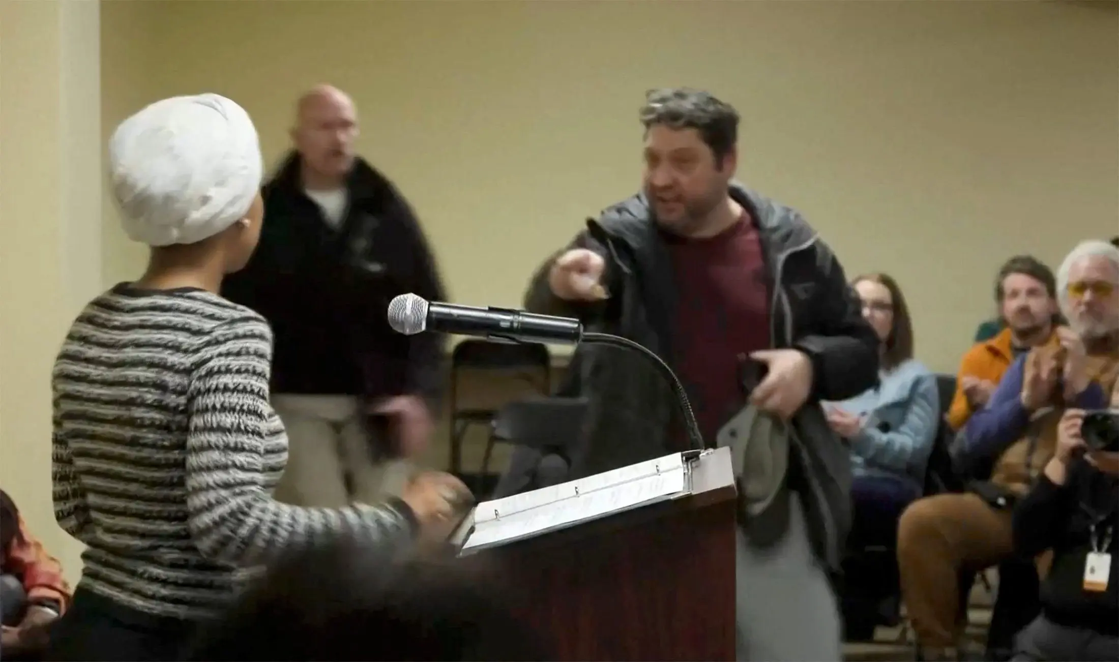 a-man-shouts-at-u-s-rep-ilhan-omar-after-spraying-her-during-a-town-hall-meeting-in-minneapolis
