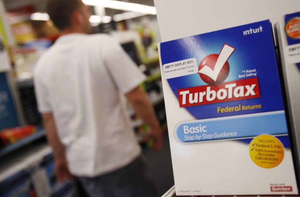 a-man-walks-past-a-turbo-tax-software-software-filing-package-on-display-at-a-staples-store-in-manhasset-new-york