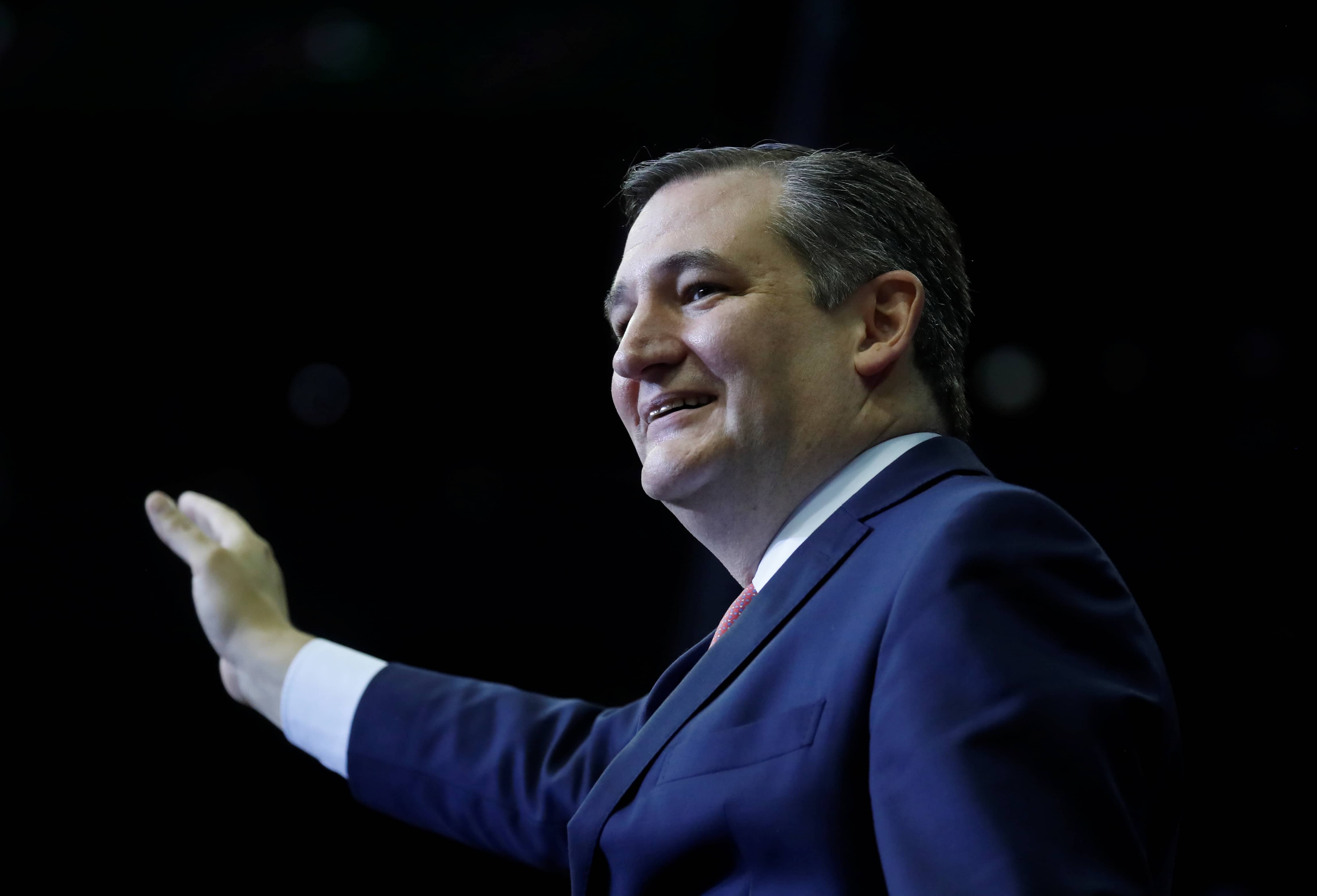 u-s-senator-cruz-r-tx-waves-to-the-crowd-at-a-campaign-rally-in-houston