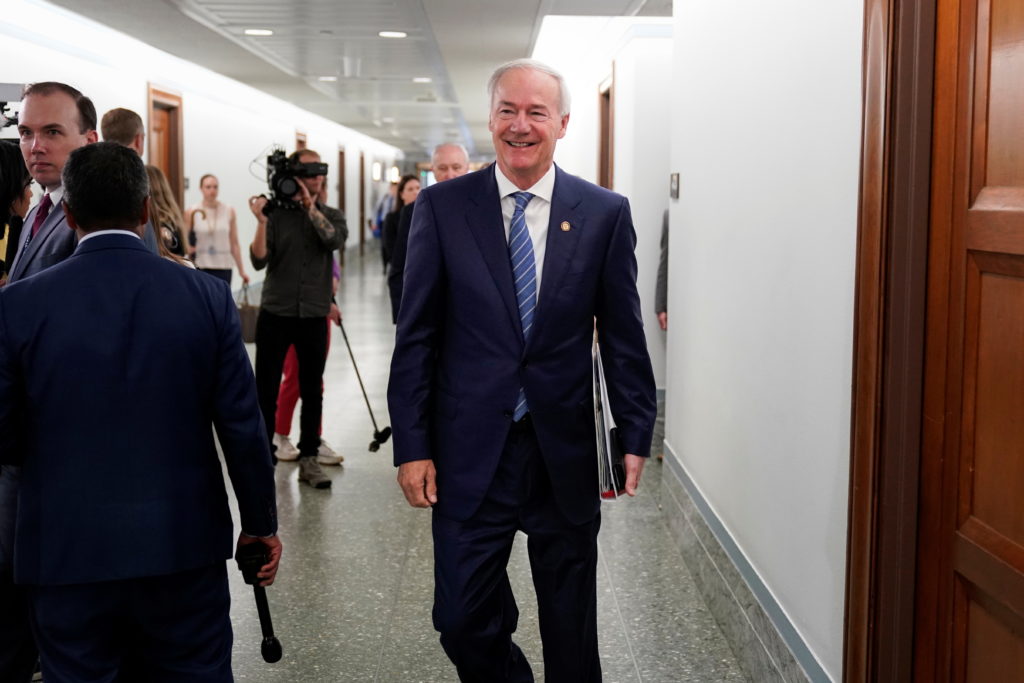 arkansas-governor-asa-hutchinson-walks-through-the-dirksen-senate-office-building-in-washington