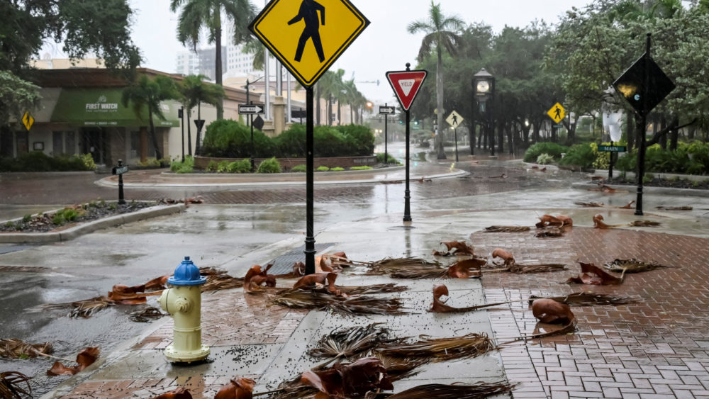 downed-palm-fronds-collect-on-an-empty-downtown-intersection-as-hurricane-ian-approaches-floridas-gulf-coast