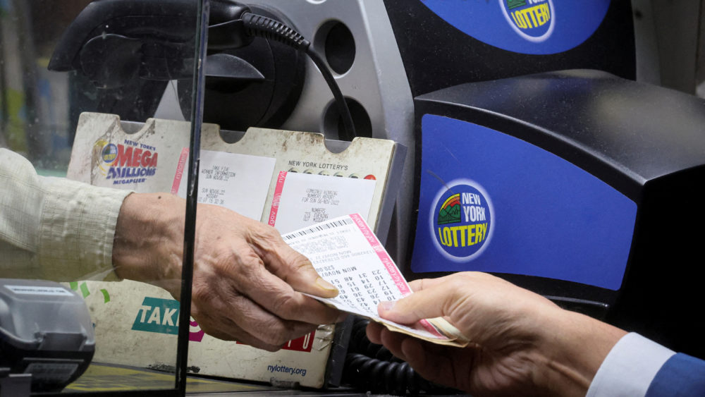 file-photo-customer-buys-powerball-lottery-ticket-in-new-york