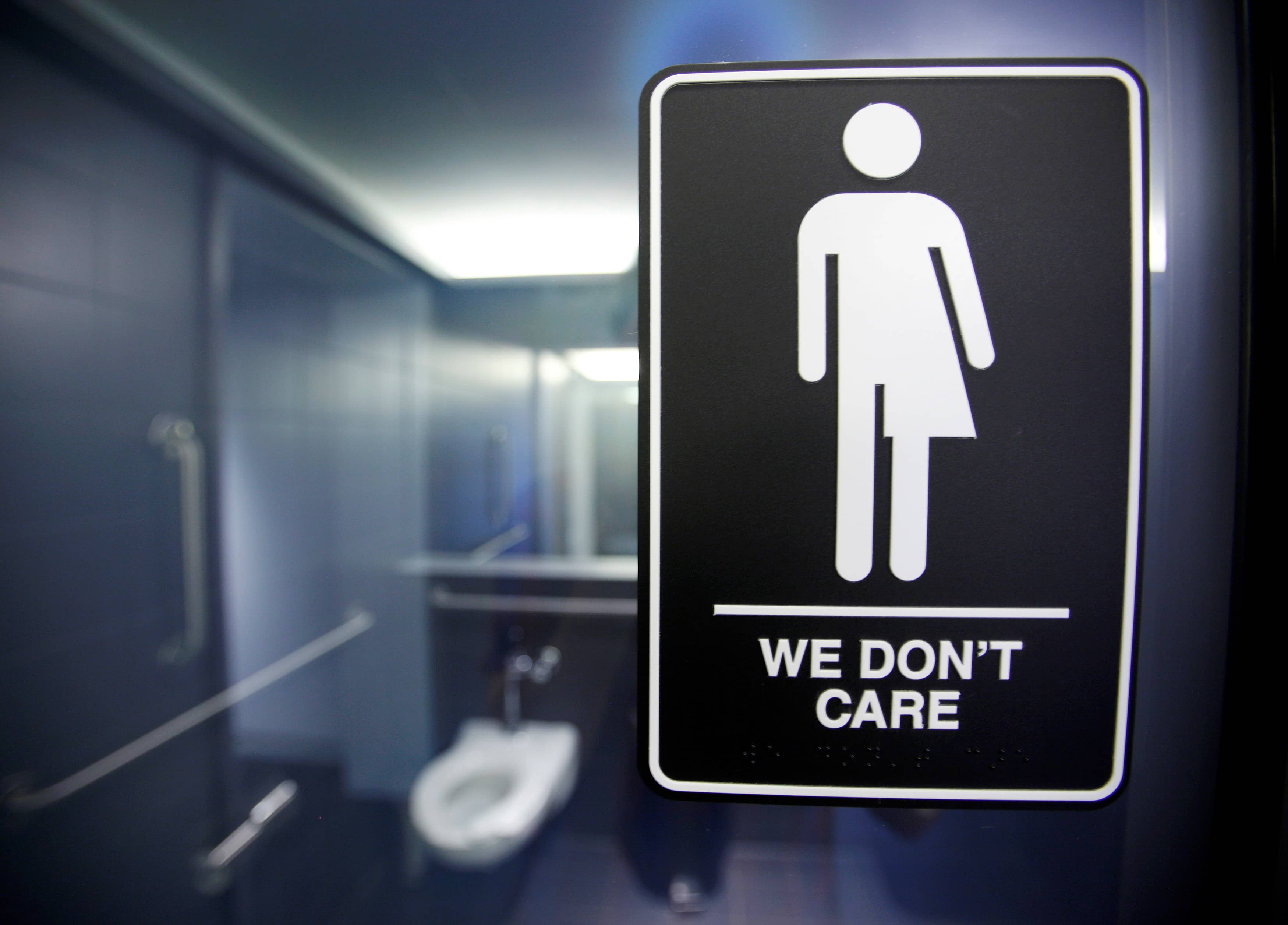 file-photo-of-a-sign-protesting-a-recent-north-carolina-law-restricting-transgender-bathroom-access-adorns-one-of-the-stalls-at-the-21c-museum-hotel-in-durham-north-carolina