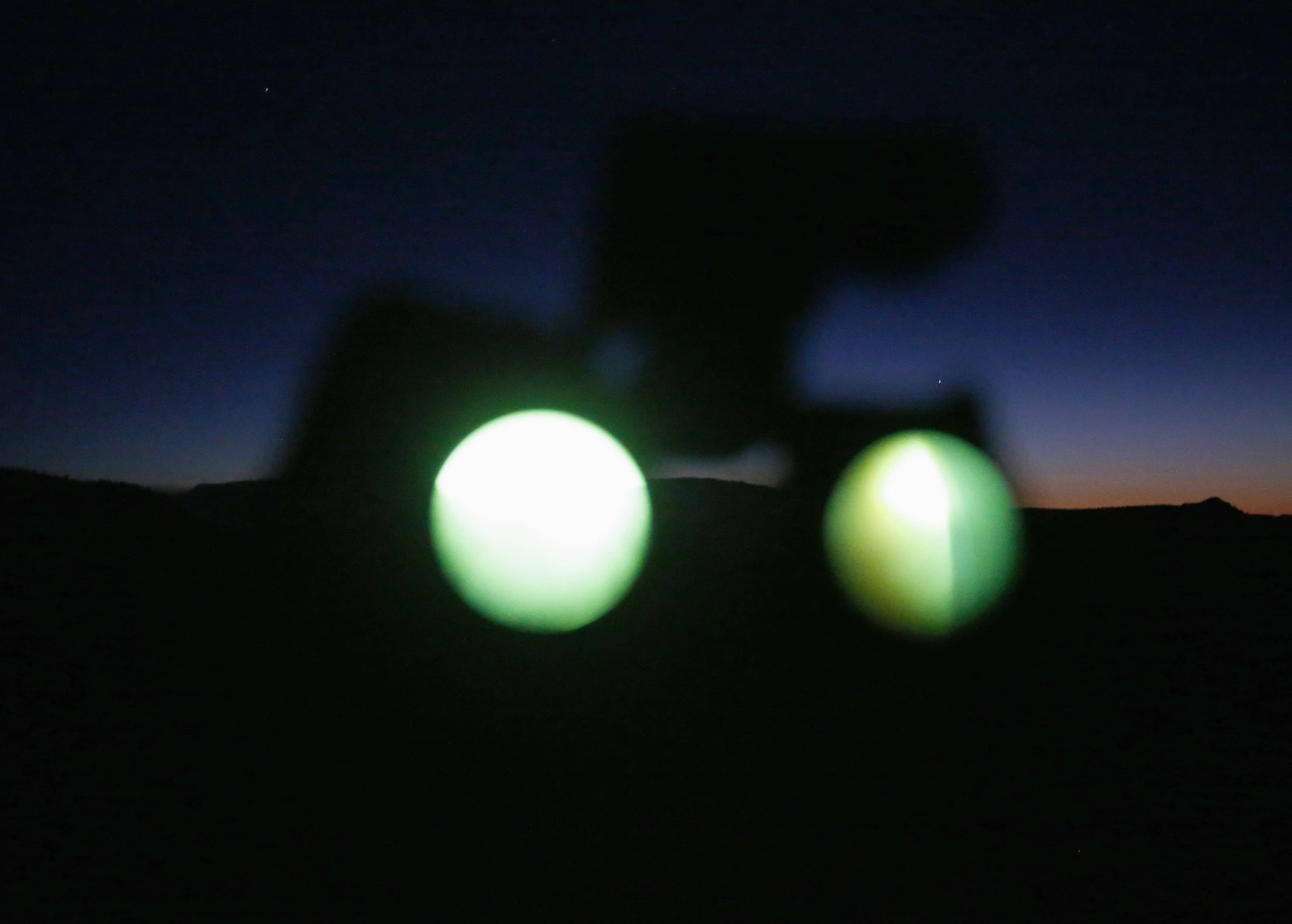a-pair-of-night-vision-goggles-are-seen-during-a-ufo-tour-in-the-desert-outside-sedona