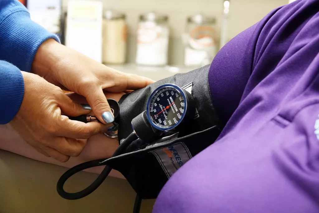 a-nurse-takes-someones-blood-pressure-inside-of-the-east-arkansas-family-health-center-in-lepanto