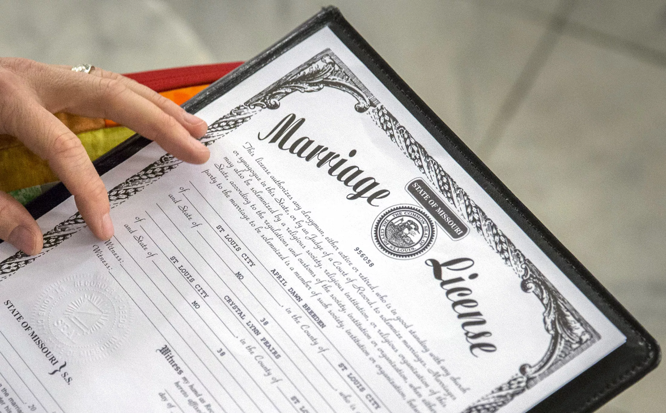 reverend-hotze-wilton-signs-a-marriage-license-at-a-same-sex-wedding-ceremony-at-city-hall-in-st-louis