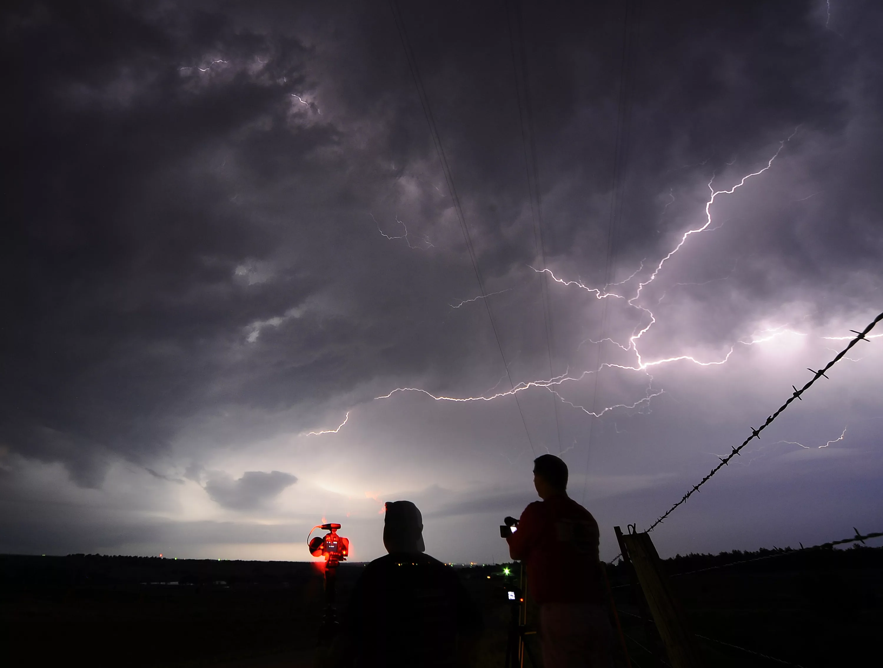 storm-chaser-photographers-mack-and-blevins-take-photos-of-lightning-from-a-tornadic-super-cell-near-apache-city