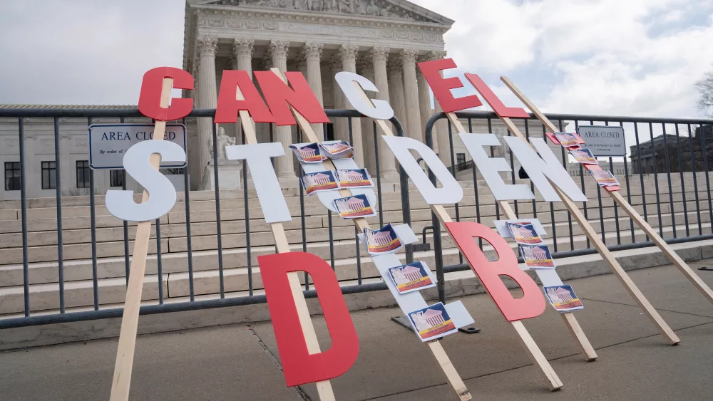 a-sign-calling-for-student-loan-debt-relief-is-seen-in-front-of-the-supreme-court