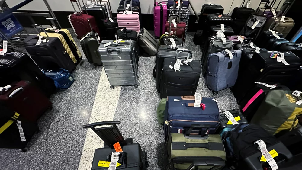 luggage-is-sorted-to-be-claimed-by-passengers-ahead-of-the-july-4th-holiday-in-boston
