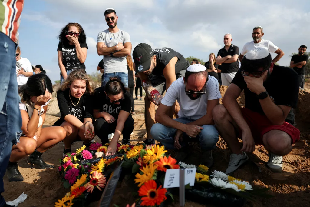 people-mourn-at-the-graveside-of-guez-at-her-funeral-in-ashkelon