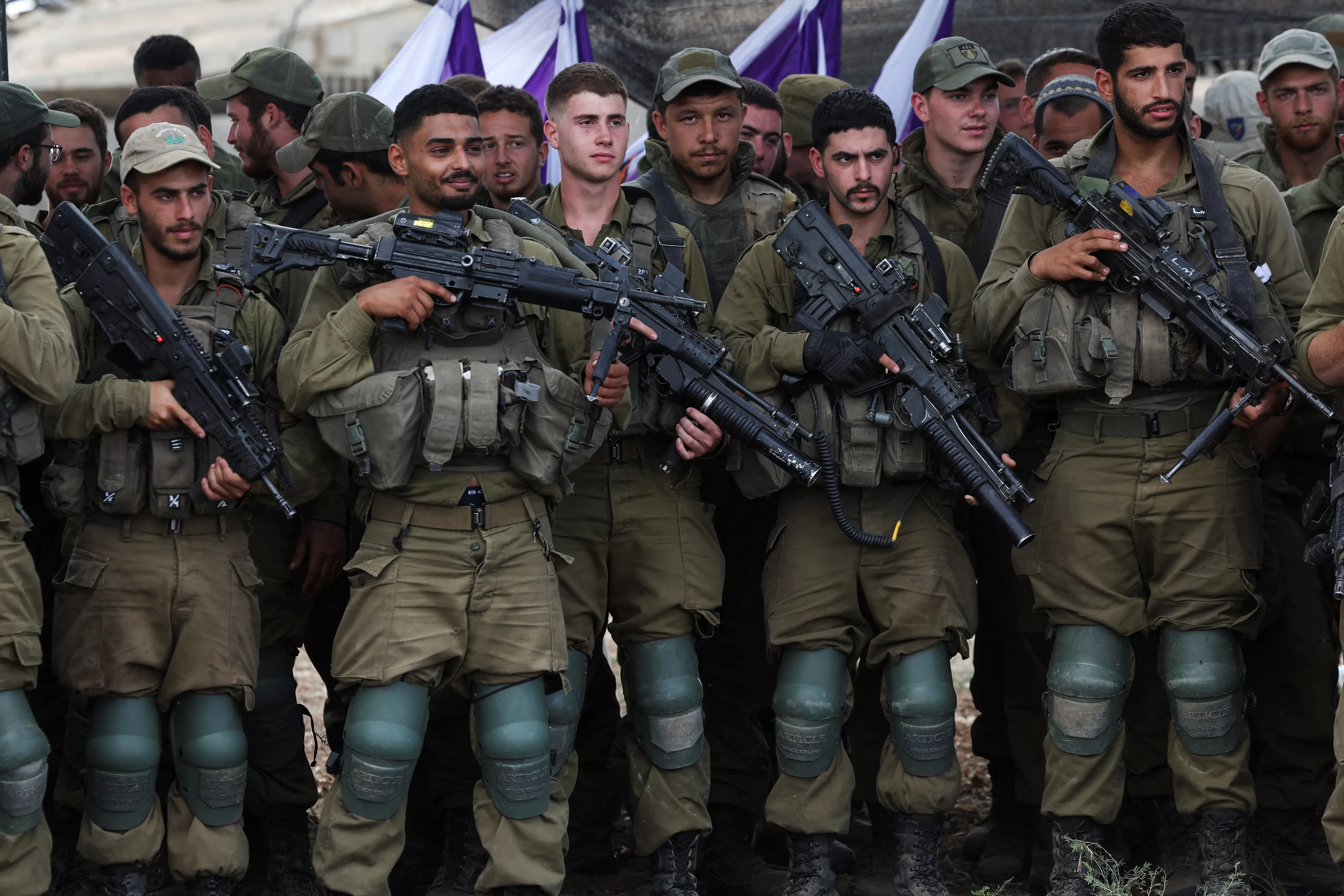 israeli-soldiers-listen-to-israels-defence-minister-yoav-gallant-as-he-meets-them-in-a-field-near-israels-border-with-the-gaza-strip-in-southern-israel