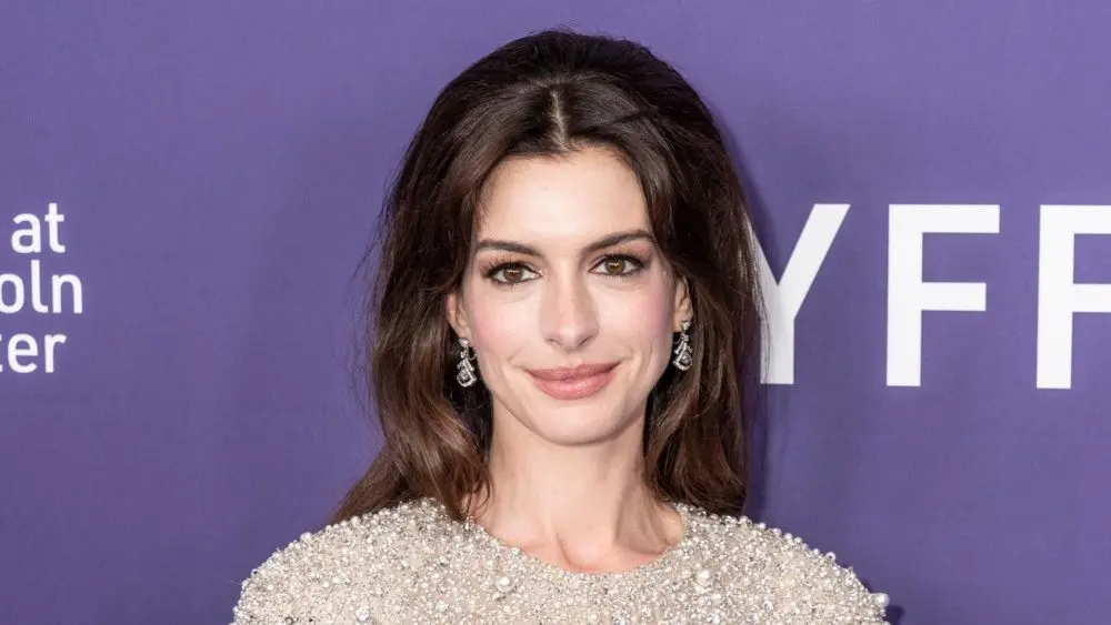 Anne Hathaway wearing dress and shoes by Valentino attends presentation of movie Armageddon Time during 60th New York Film Festival at Alice Tully Hall on October 12^ 2022