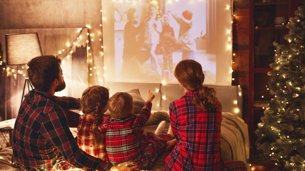 family-mother-father-and-children-watching-projector-film-movi