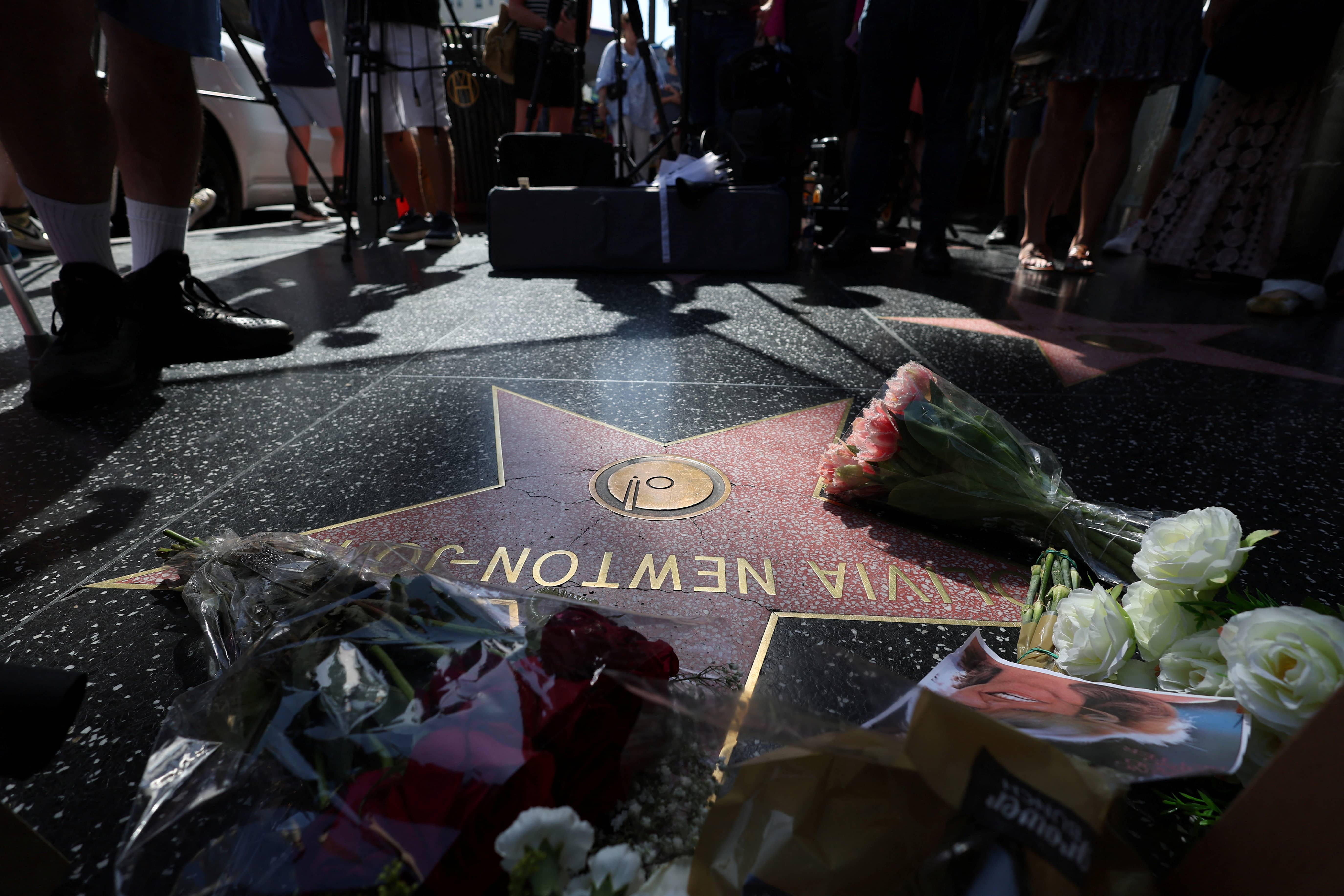 the-star-of-late-actor-olivia-newton-john-is-adorned-with-flowers-and-photographs-on-the-hollywood-walk-of-fame-in-los-angeles