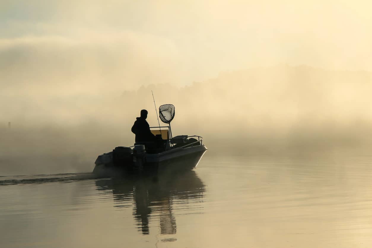 early-morning-fisherman-with-fog-on-the-lake