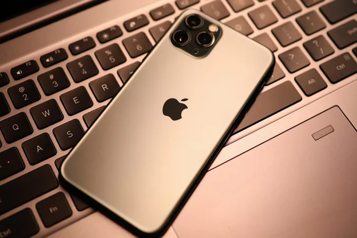 new-model-apple-iphone-lies-on-laptop-keyboard-closeup
